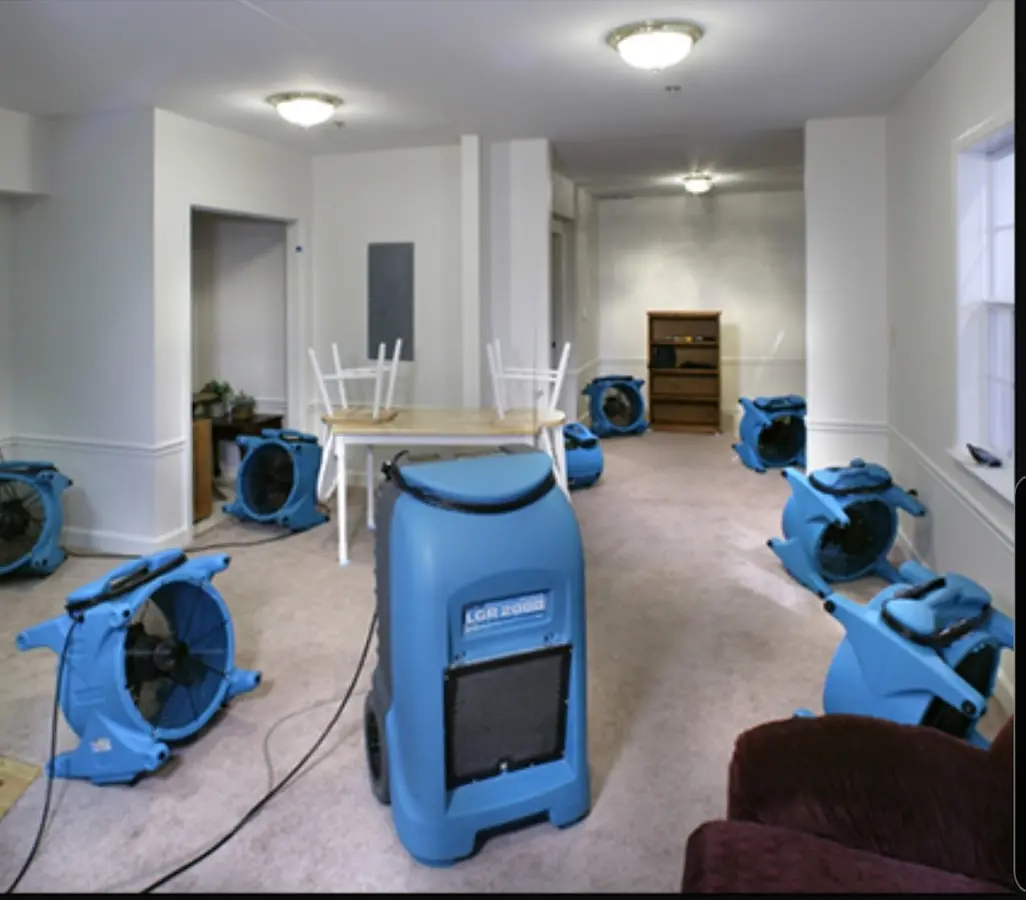 Air movers and dehumidifier setup for Water Damage Restoration in Grayson